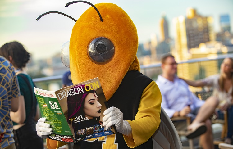 Buzz reading a magazine