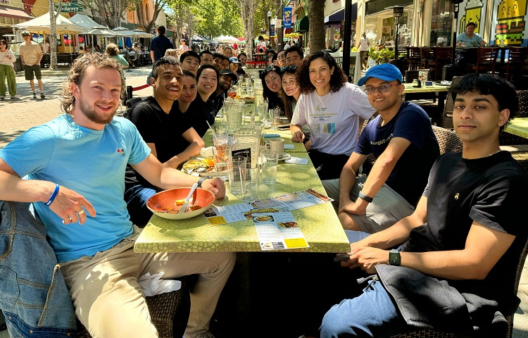 Picture of San Francisco meetup group with OMSCS and OMSA students sitting outside at a picnic table