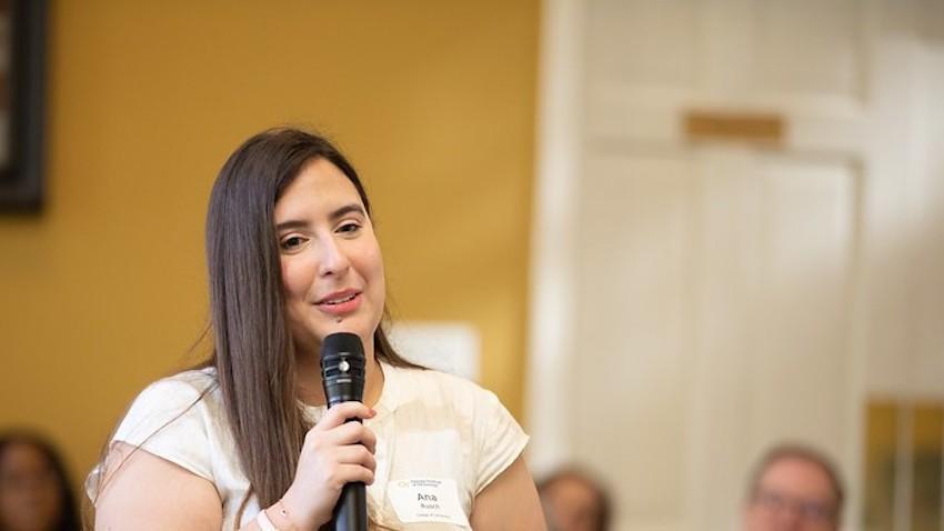 Ana Rusch speaking into a microphone