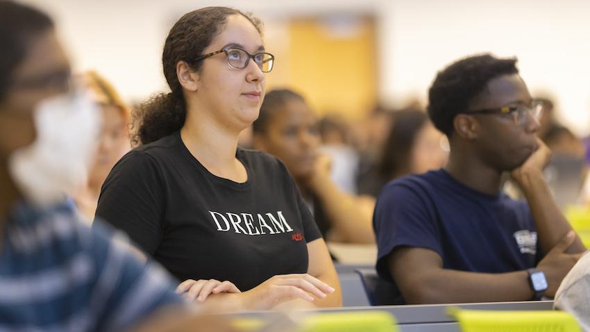 Students sitting in a classroom paying attention