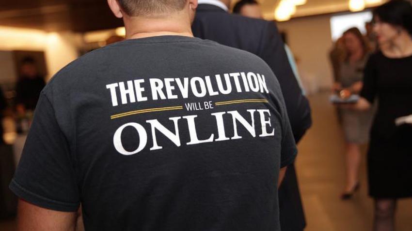 Back of an OMSCS T-shirt with the text "The Revolution Will Be Online"