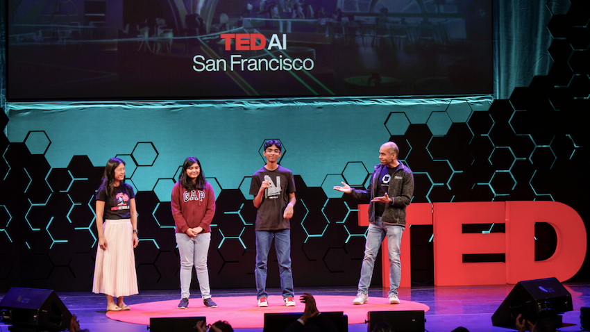 Tarun Chawdhury with family on stage at TEDAI in San Francisco