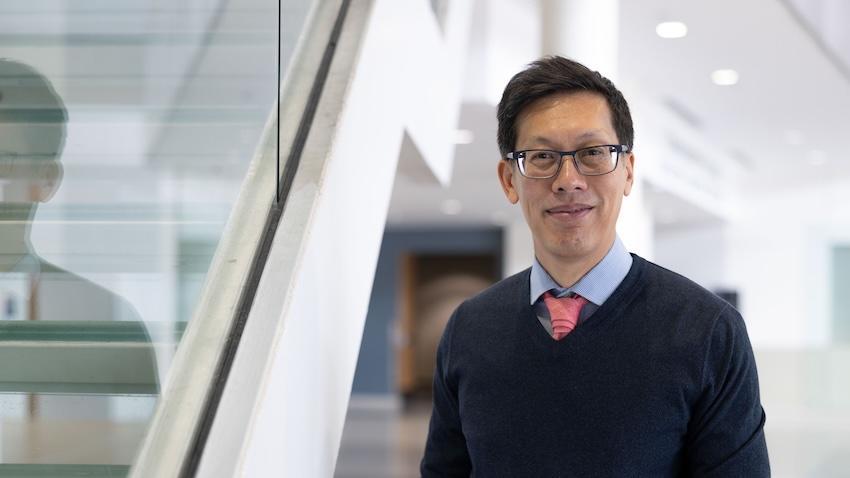Rich Vuduc standing beside a staircase inside the Klaus building