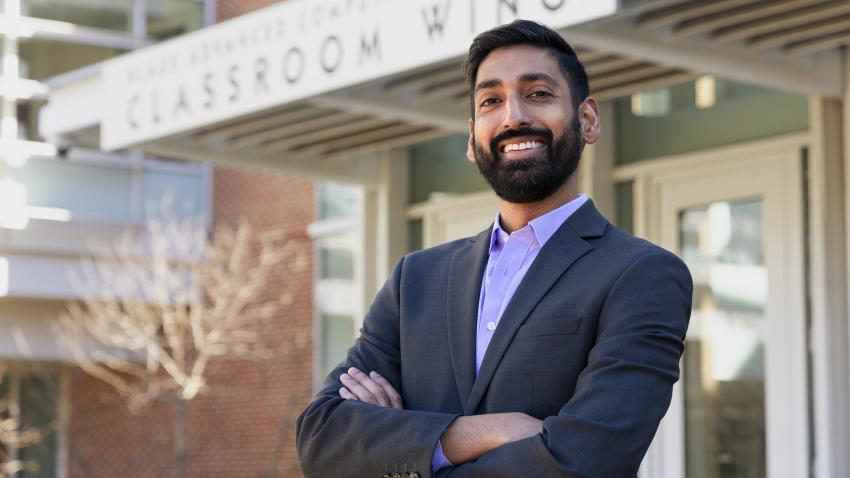 Alex Duncan standing outside the Klaus classroom building