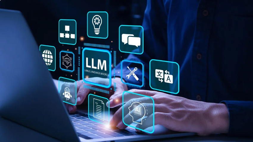 Hands typing on a laptop with icons projected in space