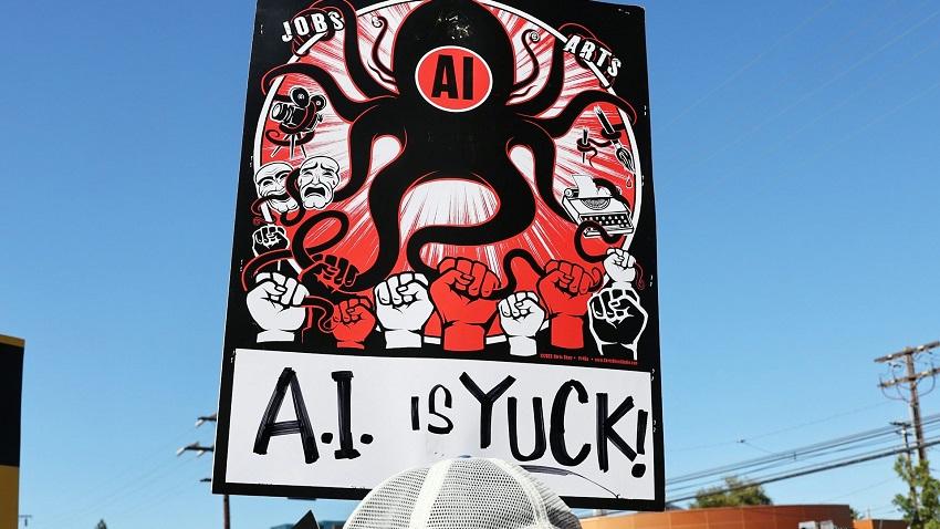 Someone holding a sign that says "AI is yuck!"