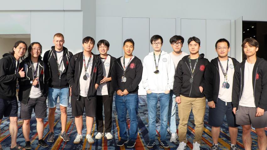 Students standing in a line wearing medals