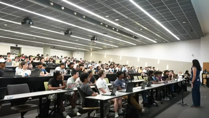 Students in a classroom looking at the speaker