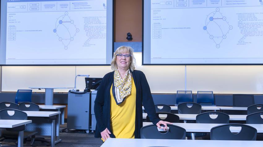 Mary Hudachek-Buswell in an empty classroom