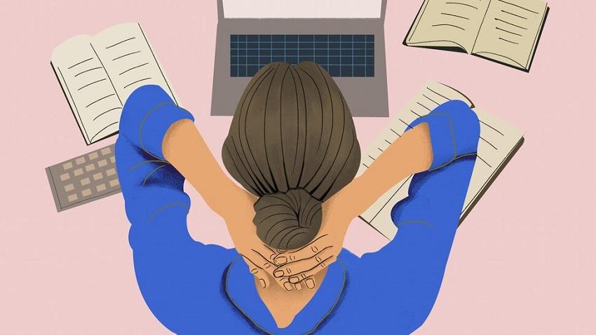 Animation showing the back of a woman's head who is sitting on front of a laptop with open books spread out around her