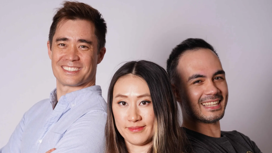 Three people standing back-to-back